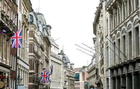 Union Jack Flags On The Side Of A Building To Show A British Residence Or Pri Stock Photos