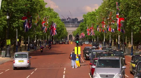 UNION JACK FLAGS TRAFFIC THE MALL LONDON ENGLAND Stock Footage 67108145