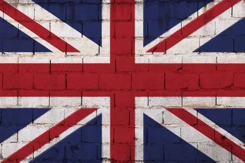 Union Jack Wall Mural: British Flag Painted on Brick Surface with Red, White, an Stock Photos