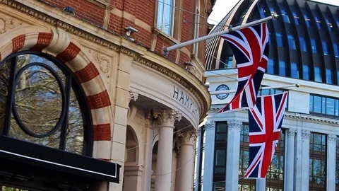 Union Jacks then Snap zoom out to empty Leicester Square Stock Footage 126887169