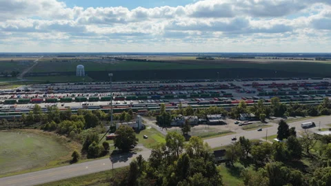 Union Pacific Freight Yard and Rural Highway Aerial Orbit Stock Footage 336692170