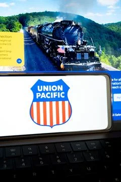 Union pacific logo on mobile device displaying historic steam train Stock Photos