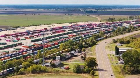 Union Pacific Rail Terminal Across Farmland and Rural Highway Stock Footage 336692641