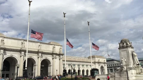 Union Station Washington D.C. flags flow at half mast train station Stock Footage 61863808