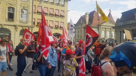 Union workers are peacefully marching in Bern, advocating for better working Stock Footage 302905911