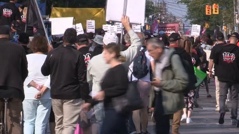 Union workers marching in solidarity for good job in Toronto labor day parade Stock Footage 79687241