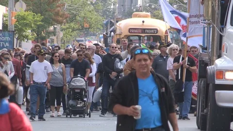 Union workers marching in solidarity for good job in Toronto labor day parade Stock Footage 79688737