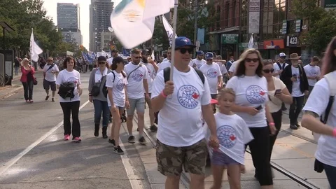 Union workers marching in solidarity for good job in Toronto labor day parade Stock Footage 79690745
