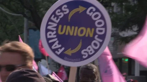 Union workers marching in solidarity for good job in Toronto labor day parade Stock Footage 79692382