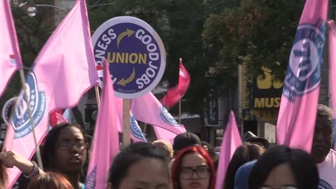 Union workers marching in solidarity for good job in Toronto labor day parade Stock Footage 79692406