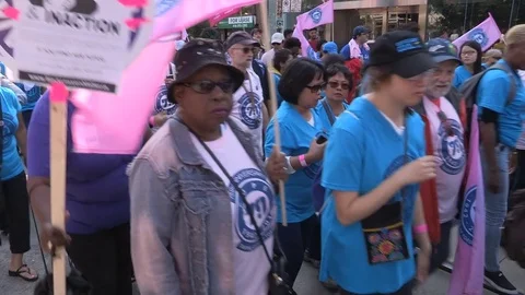 Union workers marching in solidarity for good job in Toronto labor day parade Stock Footage 79692482