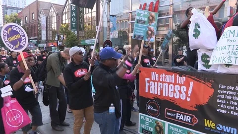 Union workers marching in solidarity for good job in Toronto labor day parade Stock Footage 79694370