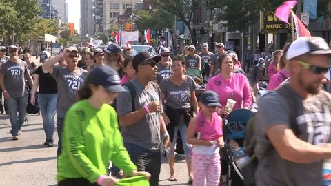 Union workers marching in solidarity for good job in Toronto labor day parade Stock Footage 79698059