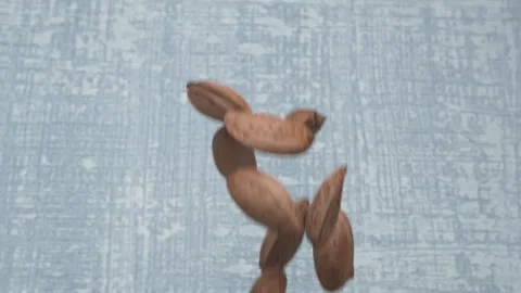 This is a unique abstract sculpture that has been crafted from a rich brown Видео 289631193