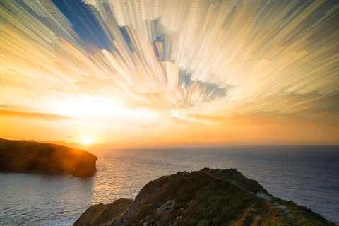 Unique abstract time lapse stack sunrise landscape over rocky coastline Foto stock