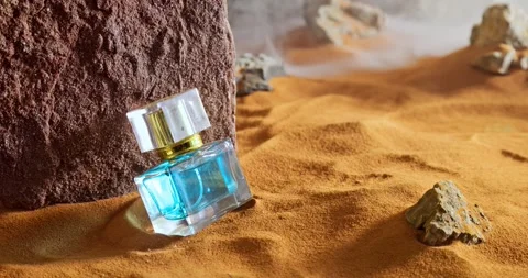 Unique amber perfumes in translucent glass bottle on sand. Stock-Footage 336022508