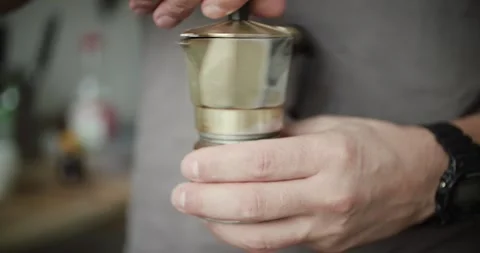 The Unique and Engaging Coffee Brewing Process Utilizing Ground Coffee and Moka Stock Footage 297373924