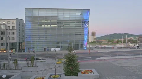 Unique architectural design in Linz, Cityscape with motion blurred cars passing Stock Footage 318544262