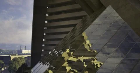 Unique architectural design of a pyramid structure beneath a modern building Ilustración de archivo