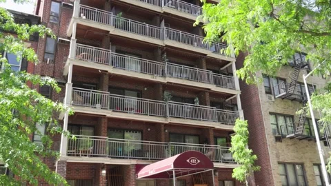 Unique architecture of an old red brick apartment building with white steel Stock Footage 242365862