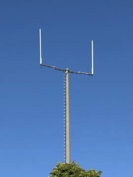 A Unique Artistic Perspective A Vertical Pole with a Frame Set Against the Clear Stock Photos
