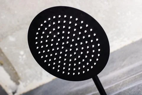 A unique black object featuring white dots scattered across its surface Stock Photos