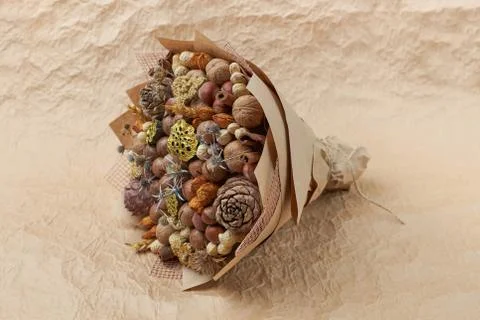 Unique bouquet of different types of nuts as an original gift Stock Photos