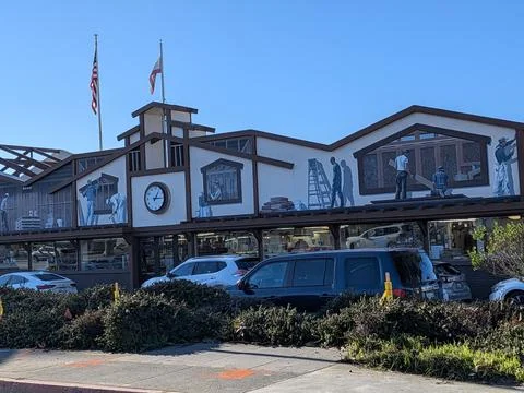 Unique building covered in hand-painted construction workers Photos