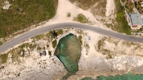 Unique Circular Rock Formation and Water Cave, Eight Mile Rock Aerial Stock Footage 89391187