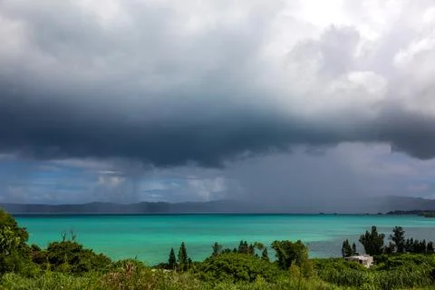 The unique clear blue waters surrounding Kouri Island and the sunlight on r.. Photos