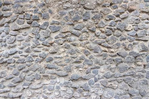 Unique Close-Up View of Rustic Textured Stone Wall Surface Stock Photos