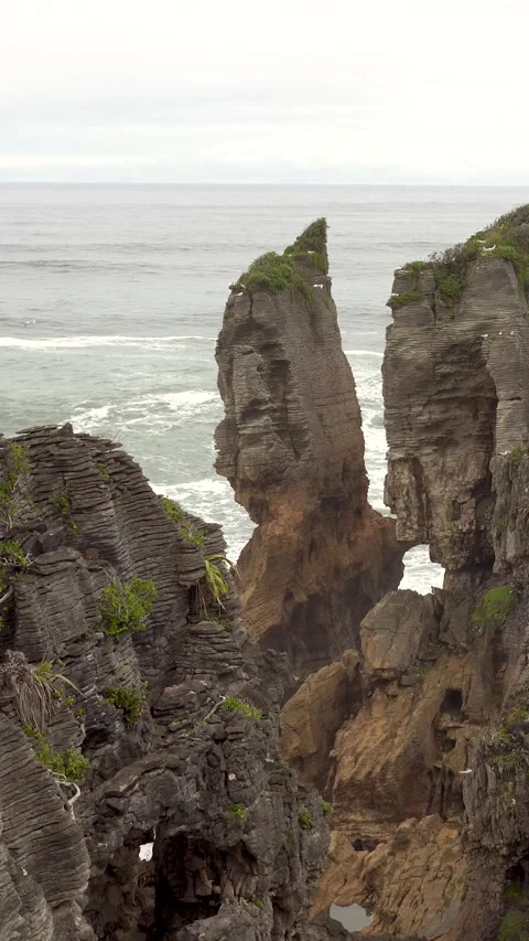 Unique coastal limestone rock formations known as Pancake Rocks and Blowholes Stock Footage 289101044
