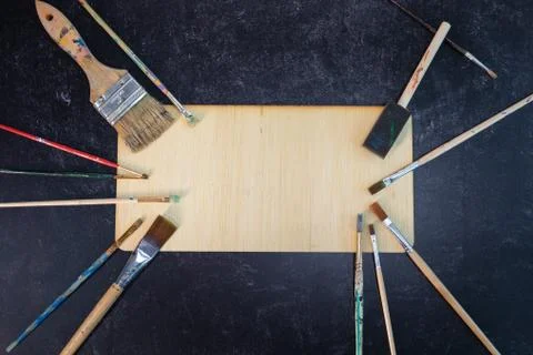 Unique creative frame surrounded by art paintbrushes blank no words add text Stock Photos