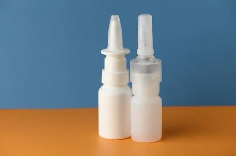 Unique design of two small bottles, showcasing contrasting shapes and color.. Stock Photos
