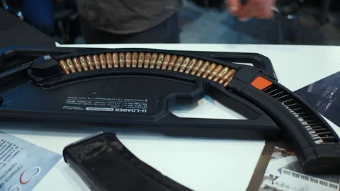 A unique device for charging the clip of an automaton, automatic and fast Stock Footage 99509926
