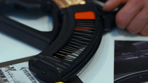 A unique device for charging the clip of an automaton, automatic and fast Stock Footage 99509931