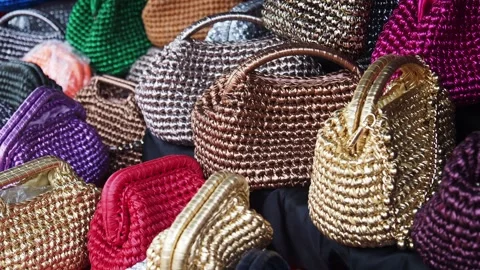 Unique handmade bags from local artisans in a vibrant market 動画素材 310283979