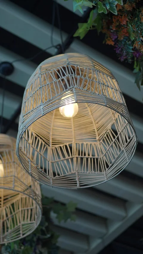Unique hanging light design inside a cafe setting Stock Footage 328002297