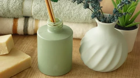Unique home decor ideas with green and white vases in cozy setting Video stock 304024646