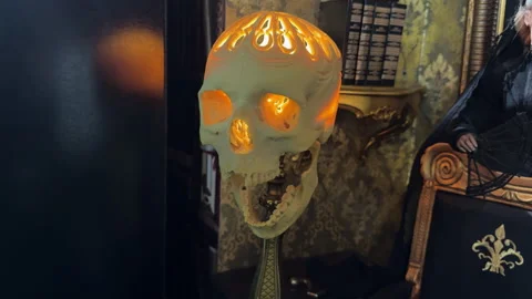 Unique human skull lamp radiates mystic warm glow. Stock Footage 310887368