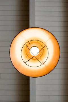 A unique lamp housing inside a coffee shop from below Stock Photos