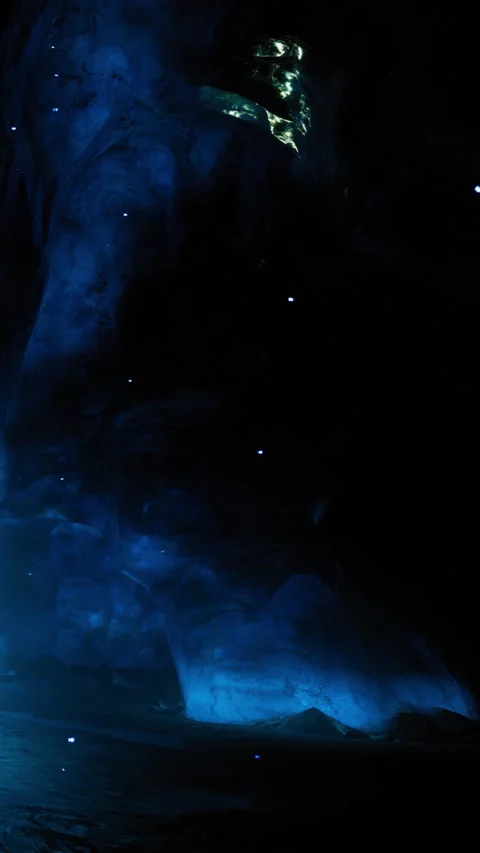 Unique light patterns are seen in a dark cave during nighttime exploration Stock Footage 331368326