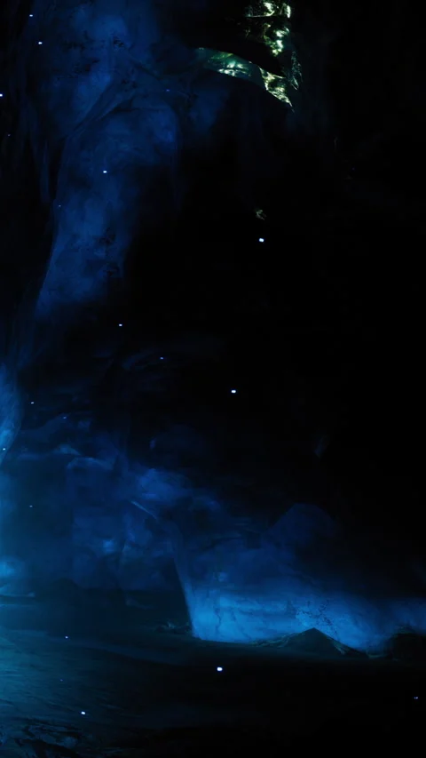 Unique light patterns are seen in a dark cave during nighttime exploration Stock Footage 332206184