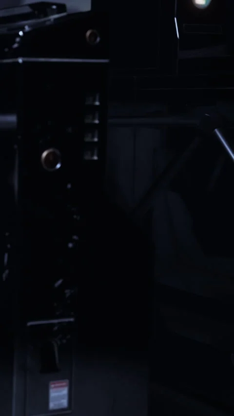 Unique light patterns create shapes in dark environment near machinery Stock Footage 338383968