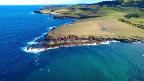 Unique Ocean Rock Formation with Rugged Cliffs Stock Footage 331623253