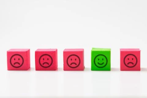 Unique, optimistic, happiness, difference concept using single happy face among Stock Photos