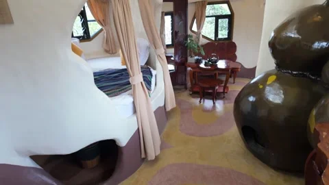 Unique organic bedroom with tea set, The Crazy House, Da Lat, Vietnam (VNM) Stock Footage 334633595
