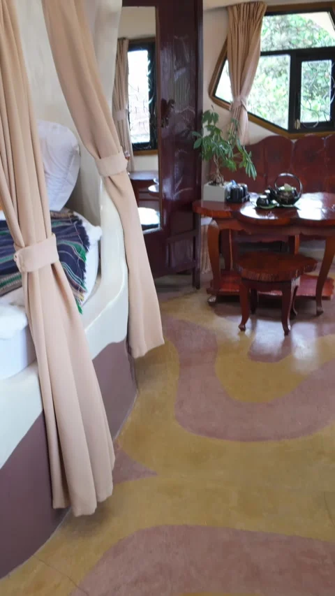 Unique organic bedroom with tea set, The Crazy House, Da Lat, Vietnam (VNM) Stock Footage 334635173