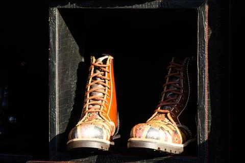 Unique Patterned Leather Biker Boots inside Display Frame Box Stock Photos