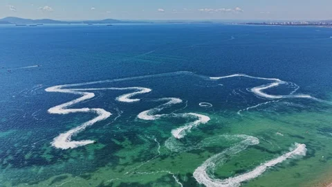 Unique patterns created by boats on water during sunny day Stock Footage 339652239